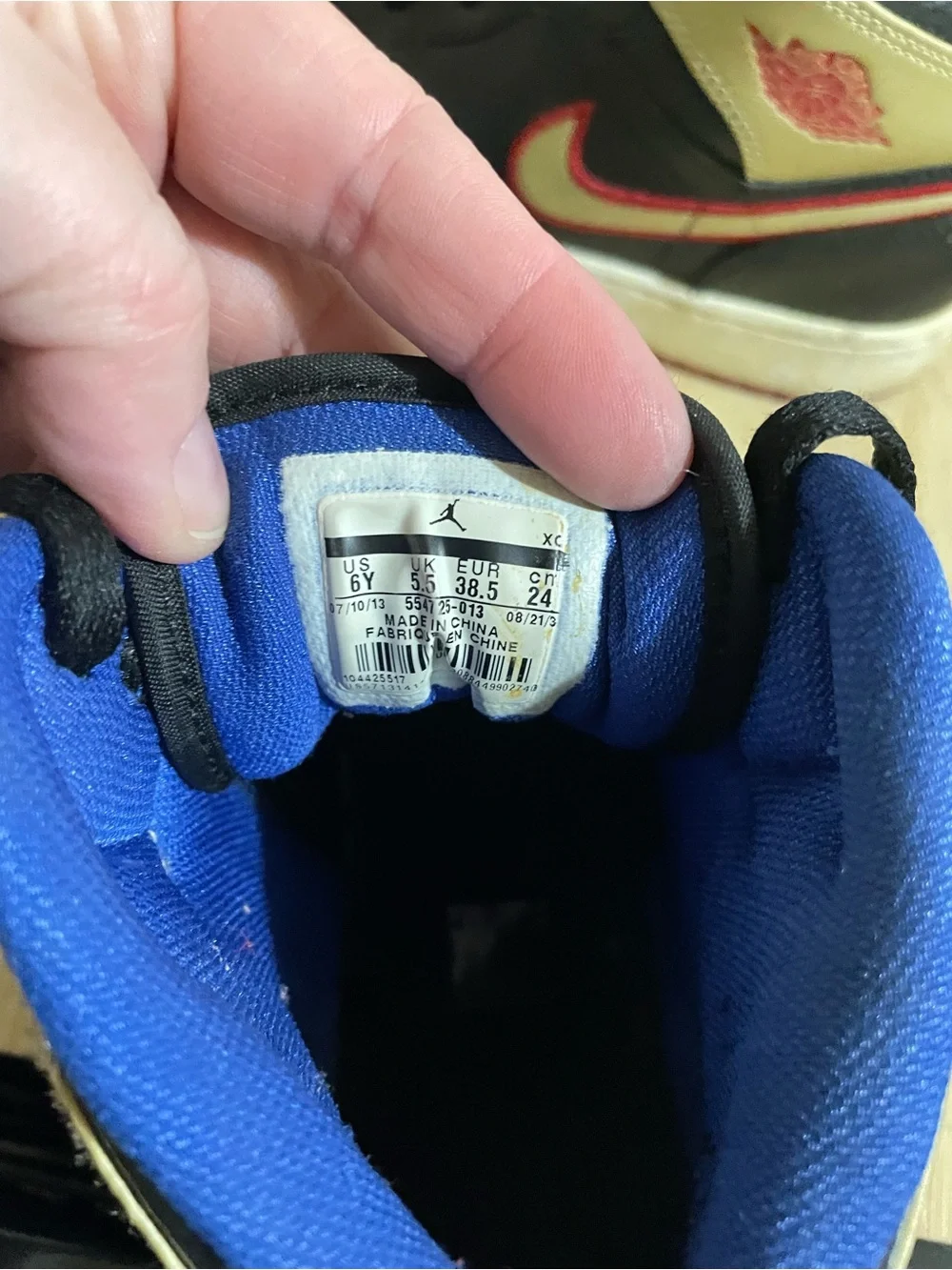Nike Kids Black and Gold High-Top Sneakers with Blue Lining